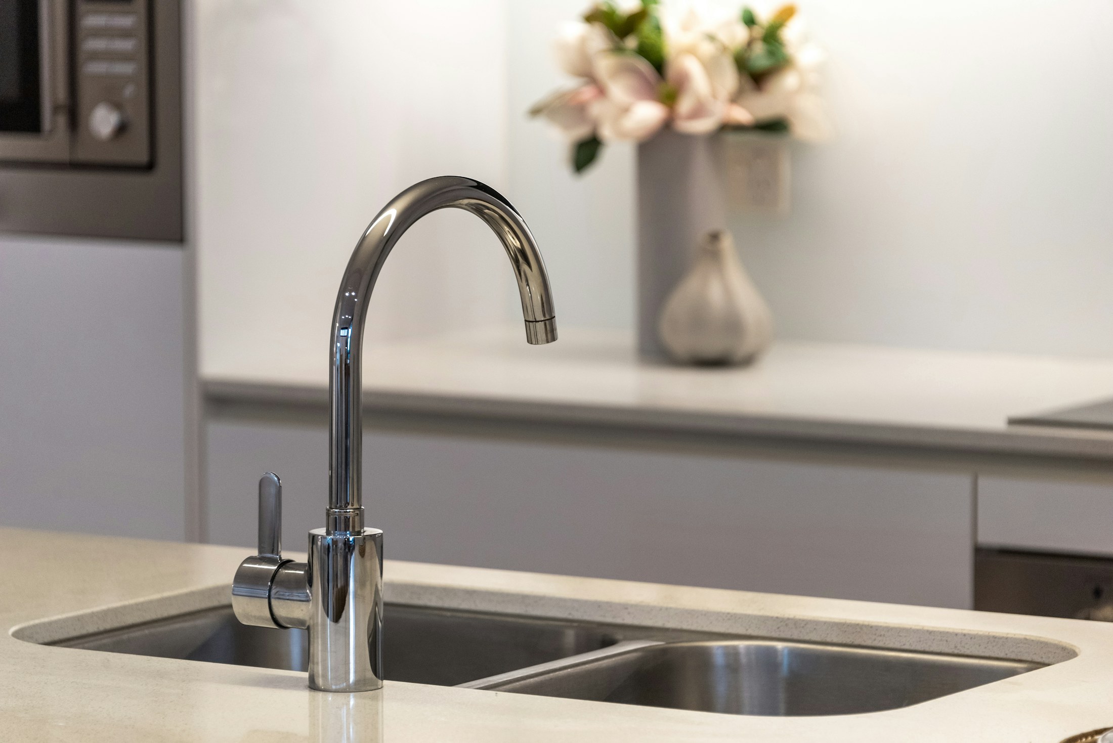 Kitchen faucet in a bright residential space