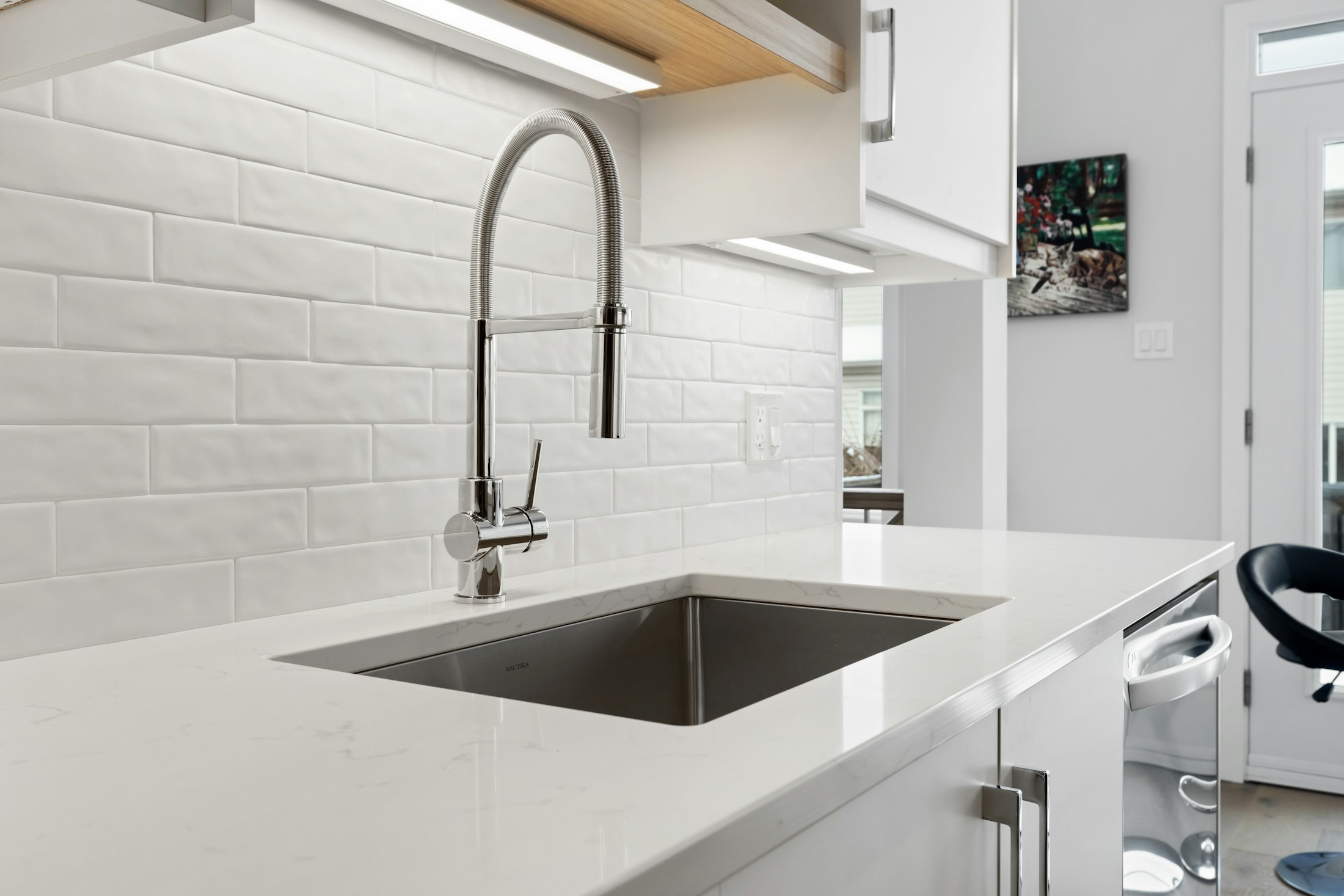 Bright kitchen with a working sink and faucet