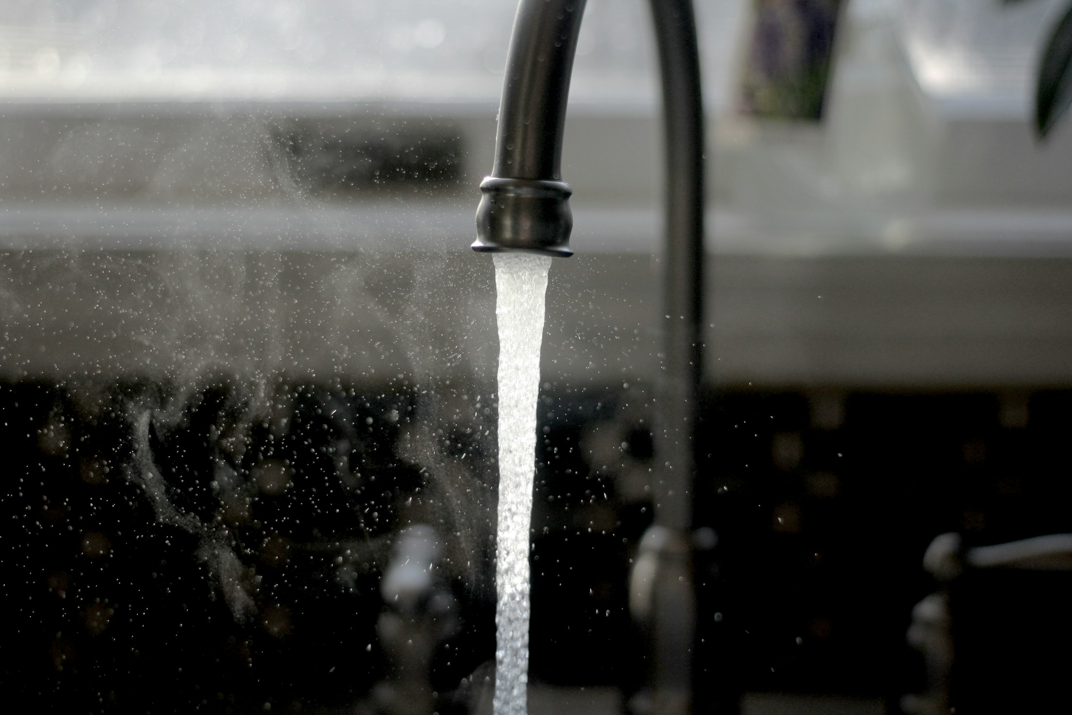 Water running from a kitchen faucet
